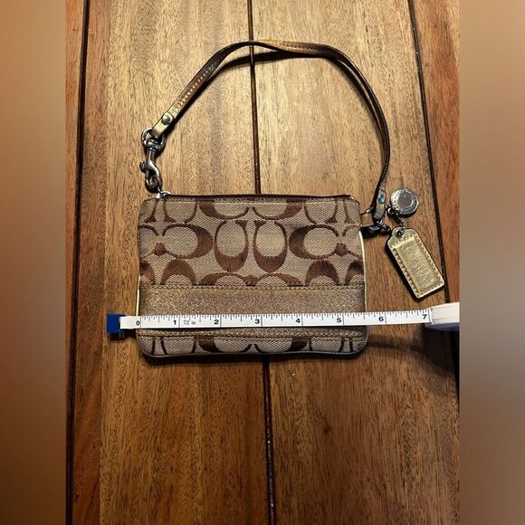 Coach Brown and Tan Signature Wristlet with gold stripe. Vintage
4x6 inches - Picture 7 of 9